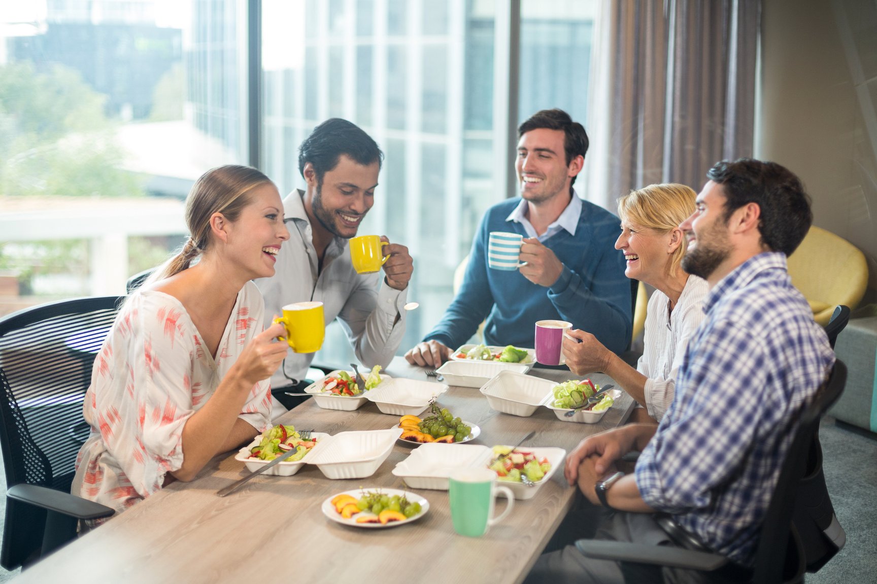 Business people having breakfast